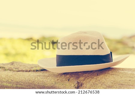 Hat at the beach on the rock.vintage