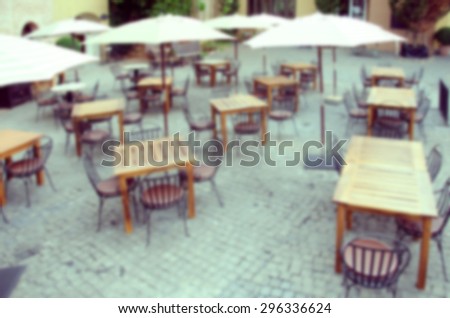 Blurred restaurant chairs outside.Instagram Style Filter