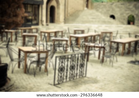 Blurred restaurant chairs outside.Instagram Style Filter
