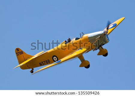 SHUTTLEWORTH, BEDFORDSHIRE, UK - MAY 1: Miles M14A Hawk Trainer 3 N3788 flying on May 1, 2011 at the Shuttleworth Air Display at Shuttleworth, Bedfordshire, UK.