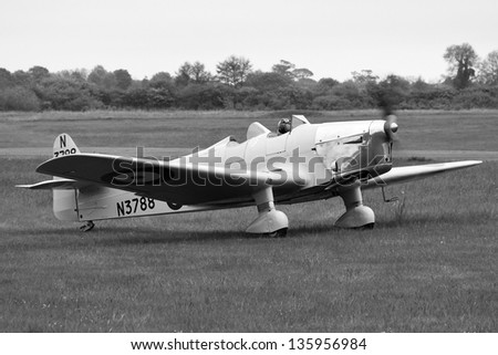 SHUTTLEWORTH, BEDFORDSHIRE, UK - MAY 19: Miles M.14A Hawk Trainer III preparing for take off on May 19, 2012 at the Shuttleworth Air Display in Shuttleworth, Old Warden Park, Bedfordshire, UK.