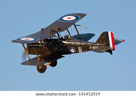 SHUTTLEWORTH, BEDFORDSHIRE, UK - JULY 6: Royal Aircraft Factory SE5a F-904 flying on July 6, 2013 at the Shuttleworth Evening Air Display in Shuttleworth, Bedfordshire, UK.