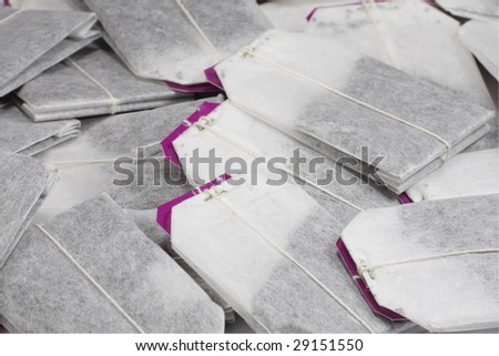 packets of black tea with red tags