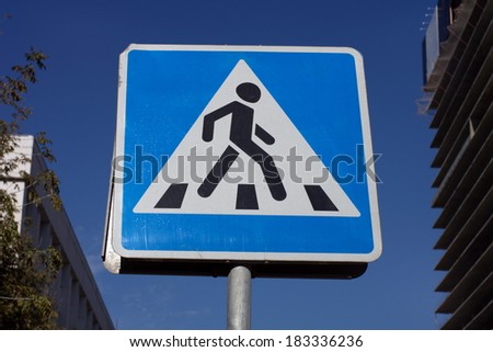 pedestrian crossing sign on street