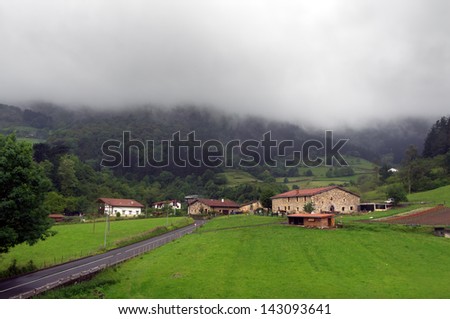 Basque country village with typically basque houses and rainy weather. Taken in Axpe, Atxondo, Basque Country, Spain