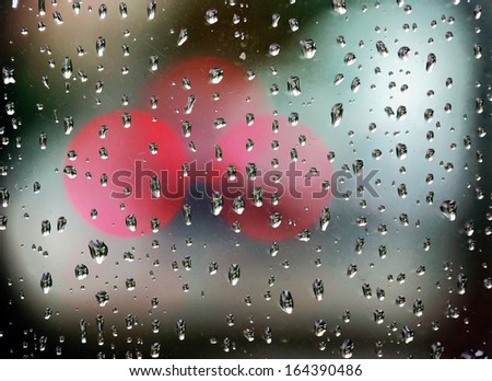 rain drops on window with bokeh lights