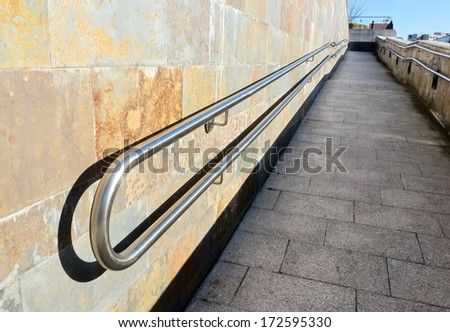 metal railings on a slope of pedestrian walkway