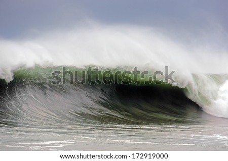 stormy weather on rough sea with big wave breaking