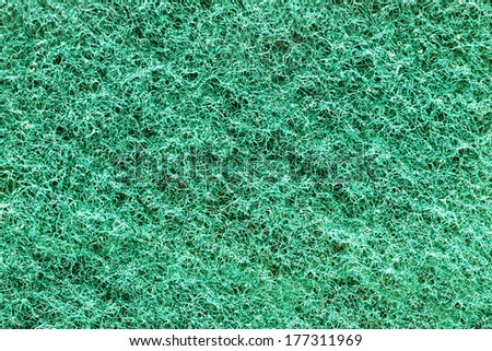 closeup of green scourer cleaning pad