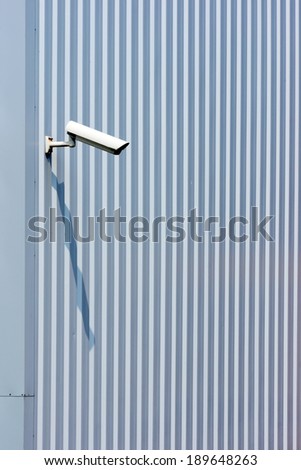 surveillance security camera on industrial wall
