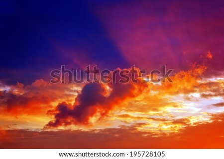 cloudscape with clouds at sunset with sun rays