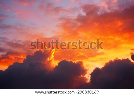 cloudscape at sunset with dramatic red clouds