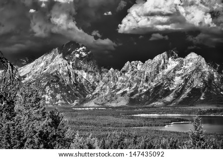 Dark skies and storm clouds over Jackson Lake and the Tetons in Wyoming