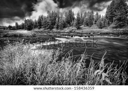 Firehole River in Yellowstone National Park under ominous fall skies