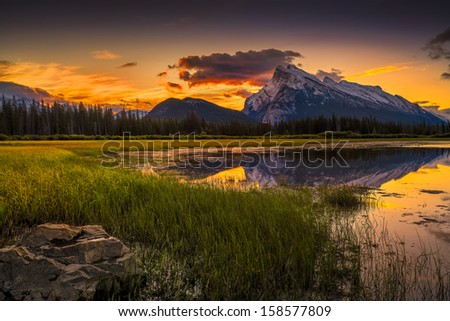 Golden Early Fall Sunrise Over The Canadian Rockies And Vermilion Lakes On The Outskirts Of Banff, Canada