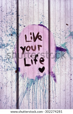 live your life tag style on wall