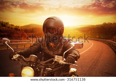 young man riding motorcycle