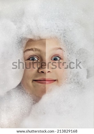 Funny little girl in a bubble bath filled with soap foam, before bath and after