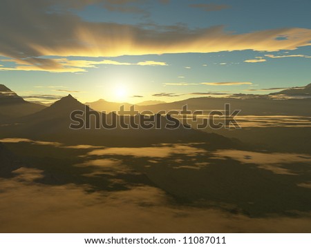 The sun rises over jungle covered mountain peaks surrounded by low lying clouds