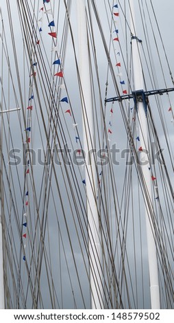 many party flags on the mast from selgelboat during the birthday celebration at the harbor