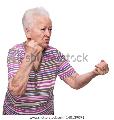 Angry old woman making fists on white background