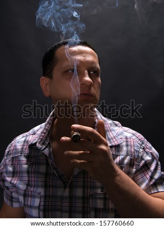 Portrait of smoking man with cigar