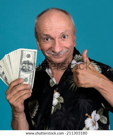 Lucky old man holding dollar bills on a blue background