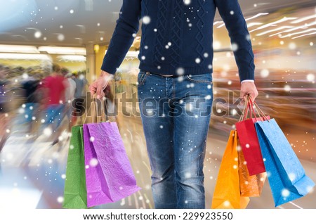 Man with shopping bags on a white background.  Christmas and holidays concept