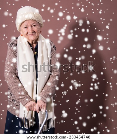 Old woman with a cane. Christmas and holidays concept