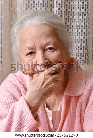 Portrait of old sad woman