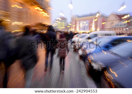 Busy city people going along the street. Intentional motion blur