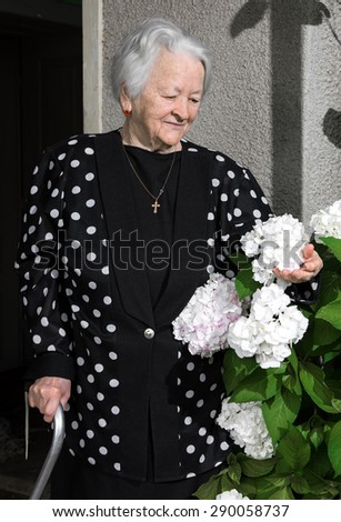 Portrait of beautiful smiling old woman outdoors