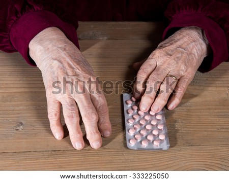 Old woman going to take the medicine at home