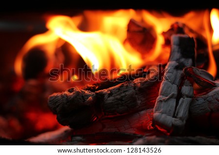 Fire wood coal amber ash closeup