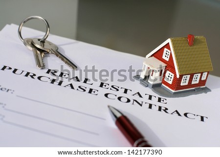 Real estate purchase contract on a table.