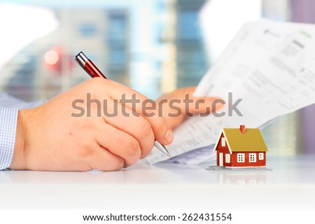 Real estate investment. Signing the loan papers.