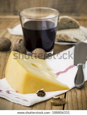Cheese with Breads, Nuts and Wine on Table