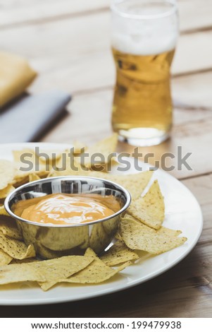 Nacho Chips with cheese and Beer
