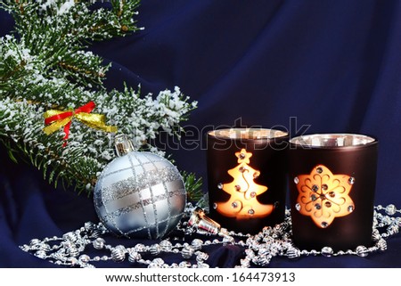 Christmas decorations with candles and silver ball on Christmas tree branches. Christmas background.