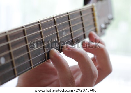 Fingers play the solo on guitar