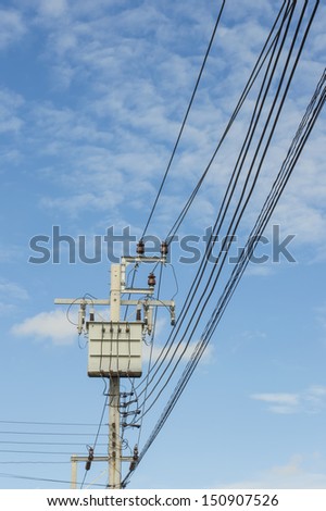Transformer on Electricity post, high power station. High voltage with blue sky