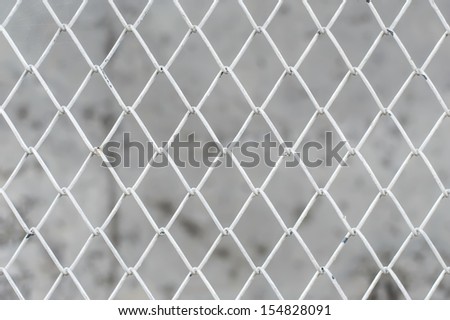 close-up white wire mesh fence