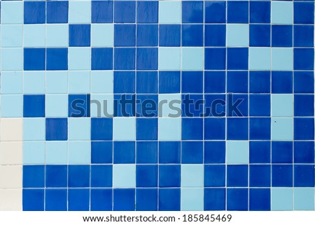 Glossy blue mosaic tiles in a bathroom.