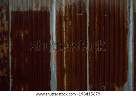 old rusty corrugated metal sheet wall as background