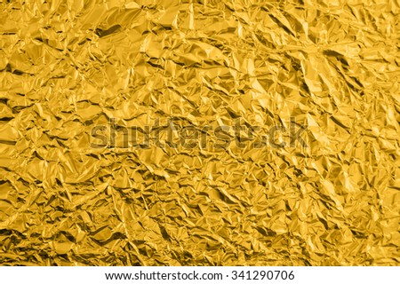 gold leaf background texture with shiny crumpled uneven surface