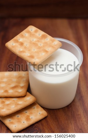 Cookies and milk on a wooden background