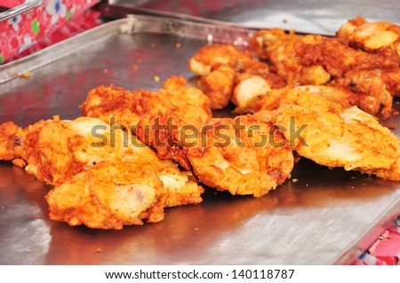 Fried chicken on stainless steel plate