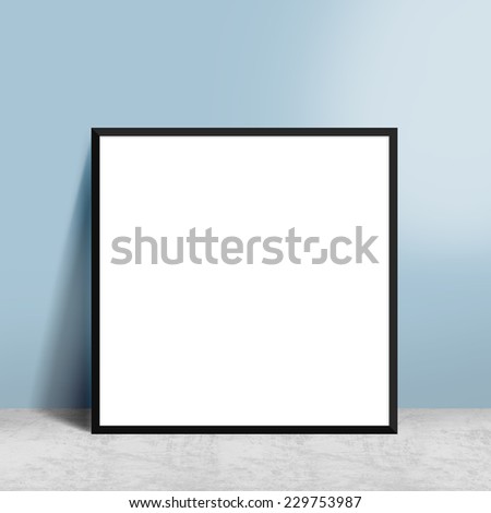 blank poster in frame hanging on wall