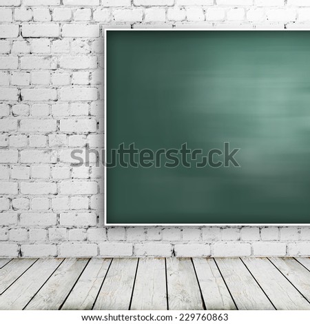 Green blackboard in brick room