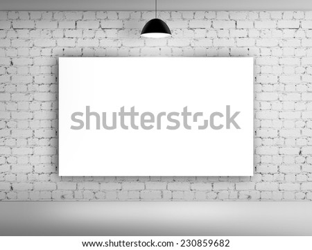 poster on brick wall with lamp
